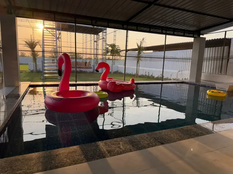 Private covered swimming pool at Green Vibes Villa lit by evening sun